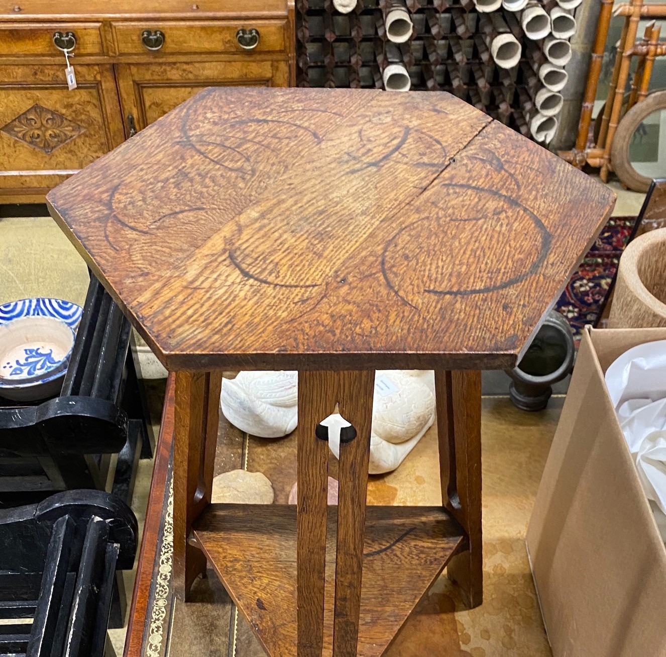 A Liberty style hexagonal oak occasional table, width 39cm, height 71cm